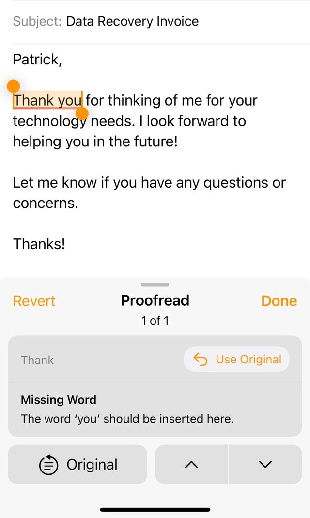 A picture of an email on iOS being proofread by Apple's AI tool and failing to realize that the 'Thank you' message highlighted actually _does_ contain the word 'you'